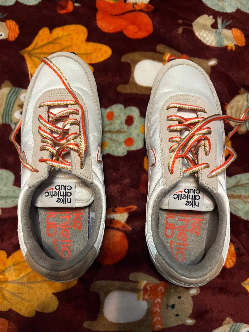 Nike Men’s White Sneakers with Orange Accents